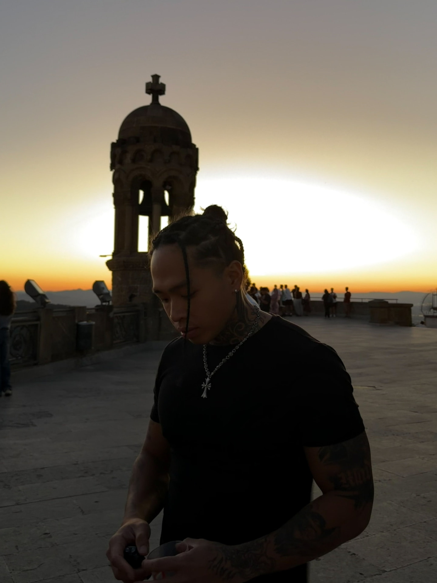 Wilson, tattoo artist, at sunset above Barcelona